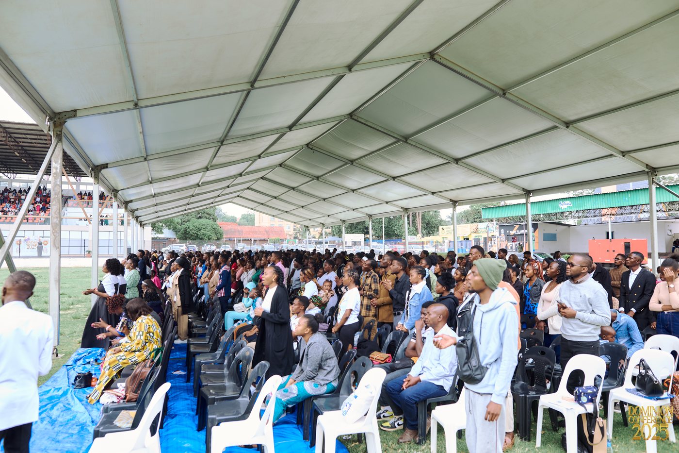 Worshippers standing in the main tent