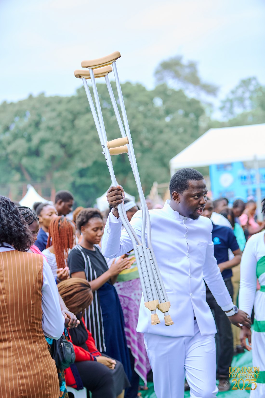 A miracle moment at Dominion Conference — crutches lifted high